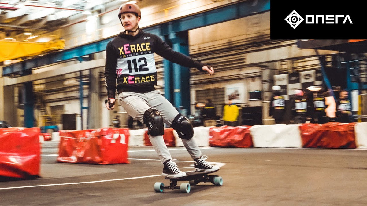 Rider with number 112 on an electric skateboard at an indoor xErace race, video preview