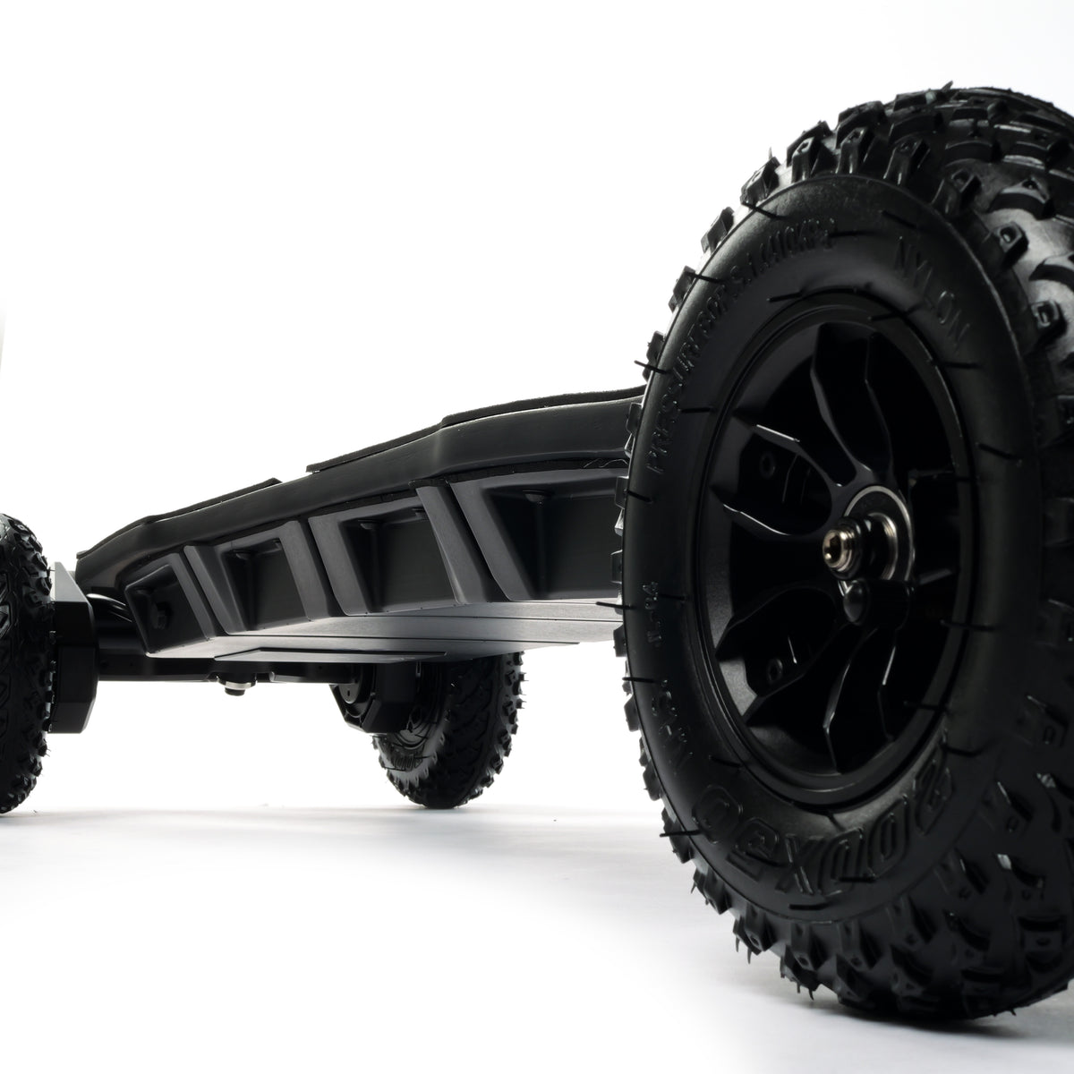 ONSRA BLACK Carve 4 premium electric longboard with a flexible bamboo deck, Gear Drive drivetrain, 14S battery, precision trucks, and all-terrain wheels, shown in a side profile.